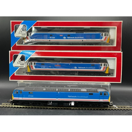 48 - Three Lima Boxed Diesel/Electric Locomotives Tested Runners
(1400g)
Lima 205220 Class 47 'Great East... 