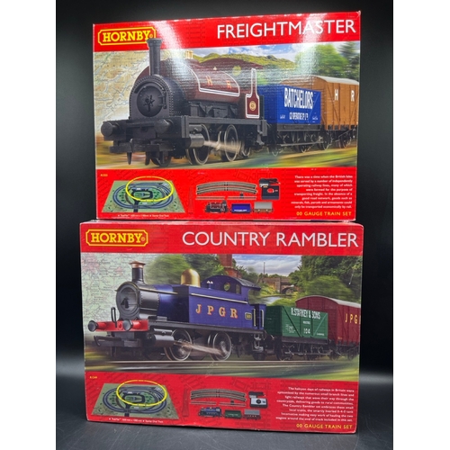 26 - Two Hornby OO Gauge Train Sets, both complete
(3000g)
R1249 Country Rambler, unopened in original sh... 