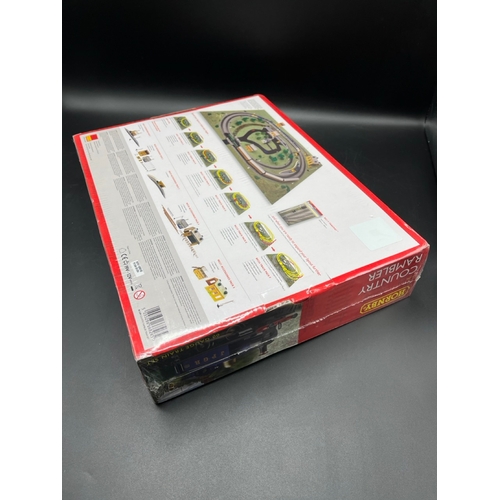 26 - Two Hornby OO Gauge Train Sets, both complete
(3000g)
R1249 Country Rambler, unopened in original sh... 