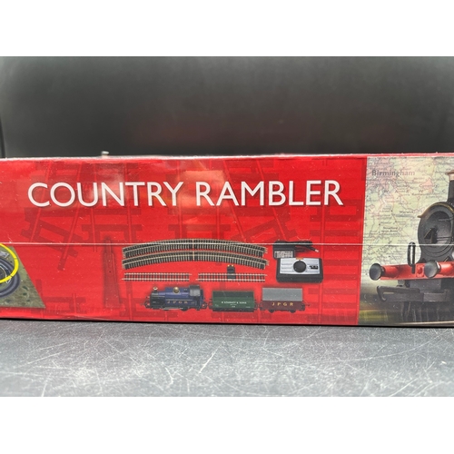 26 - Two Hornby OO Gauge Train Sets, both complete
(3000g)
R1249 Country Rambler, unopened in original sh... 