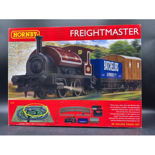 26 - Two Hornby OO Gauge Train Sets, both complete
(3000g)
R1249 Country Rambler, unopened in original sh... 