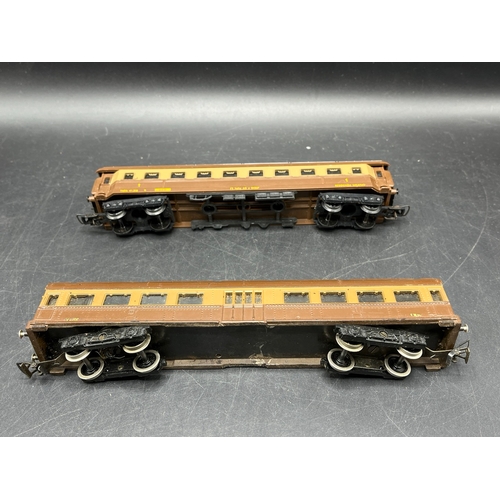 125 - A continental Locomotive, Tram and Railcar each motorised with two Brown/Silver cars/coaches
(2500g)... 