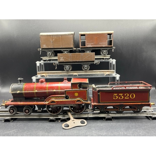 114 - Bing for Bassett-Lowke red LMS 'George V' 4-4-0 loco and tender No. 5320 Clockwork with three Basset... 