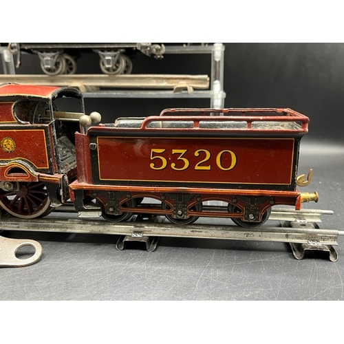 114 - Bing for Bassett-Lowke red LMS 'George V' 4-4-0 loco and tender No. 5320 Clockwork with three Basset... 