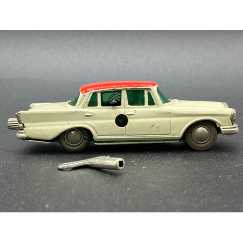 257 - Two Schuco Micro Racers
(300g)
Schuco Micro Racer 1038 Mercedes 220S with key - Operation not perfec... 