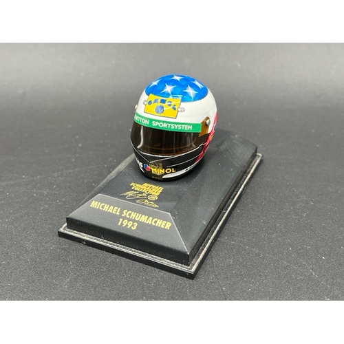 298 - 13 Minichamps 1/8 scale Michael Schumacher drivers Helmets spanning 1989 to 1998, plus two Hot Wheel... 