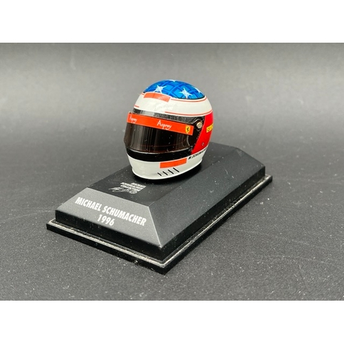 298 - 13 Minichamps 1/8 scale Michael Schumacher drivers Helmets spanning 1989 to 1998, plus two Hot Wheel... 