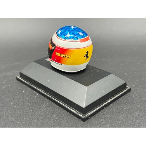 298 - 13 Minichamps 1/8 scale Michael Schumacher drivers Helmets spanning 1989 to 1998, plus two Hot Wheel... 