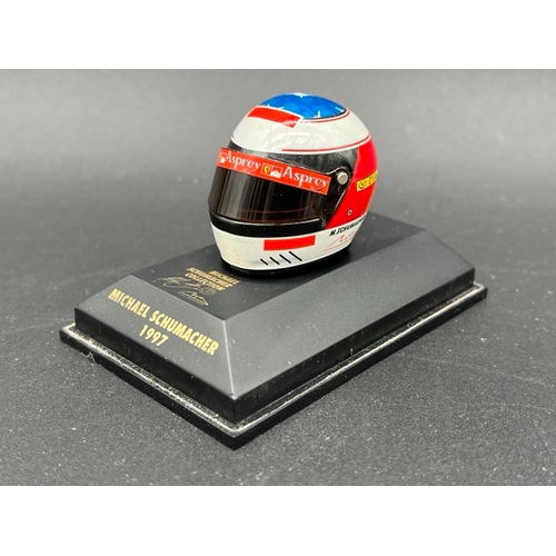 298 - 13 Minichamps 1/8 scale Michael Schumacher drivers Helmets spanning 1989 to 1998, plus two Hot Wheel... 