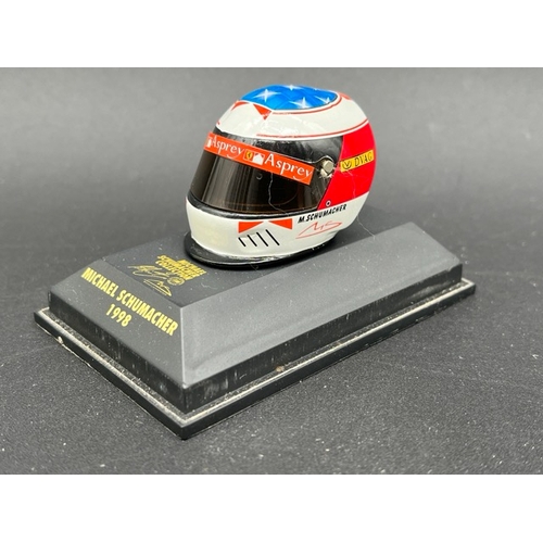 298 - 13 Minichamps 1/8 scale Michael Schumacher drivers Helmets spanning 1989 to 1998, plus two Hot Wheel... 