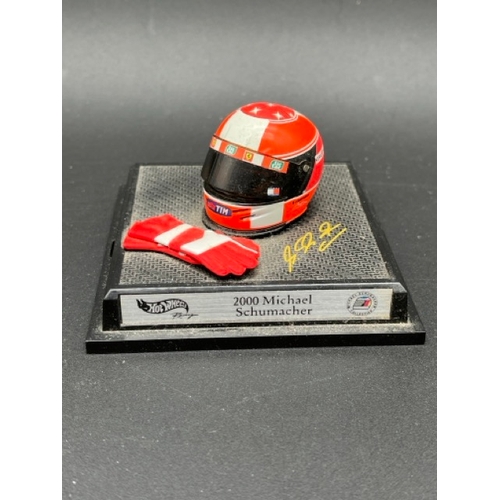 298 - 13 Minichamps 1/8 scale Michael Schumacher drivers Helmets spanning 1989 to 1998, plus two Hot Wheel... 