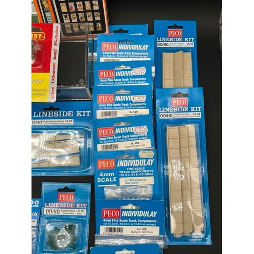 114 - A Job Lot of Sealed un-used OO gauge model railway kits, track components and two Hornby Point motor... 