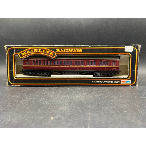 438 - Four Boxed OO Mainline Maroon Vans and Coach
(800g)
Mainline 37115 Ex-LMS 57' Composite Corridor M35... 