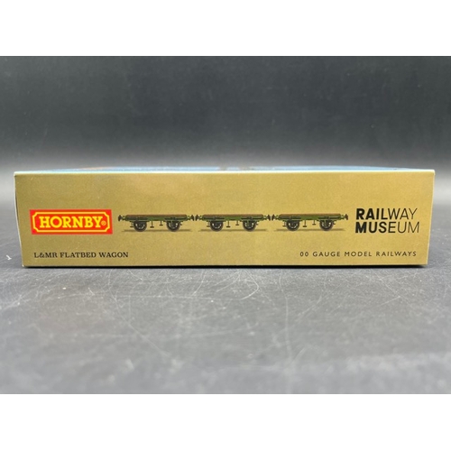 386 - Three 'As New' Boxes containing 7 Hornby Liverpool and Manchester Railway wagons
(400g)
Hornby R6001... 