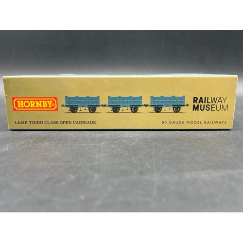 386 - Three 'As New' Boxes containing 7 Hornby Liverpool and Manchester Railway wagons
(400g)
Hornby R6001... 