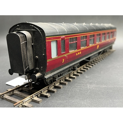 73 - An Edward Exley & Co. O Gauge LMS eight wheel passenger coach, LMS Maroon with black roof, Third cla... 