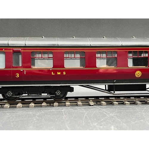 73 - An Edward Exley & Co. O Gauge LMS eight wheel passenger coach, LMS Maroon with black roof, Third cla... 