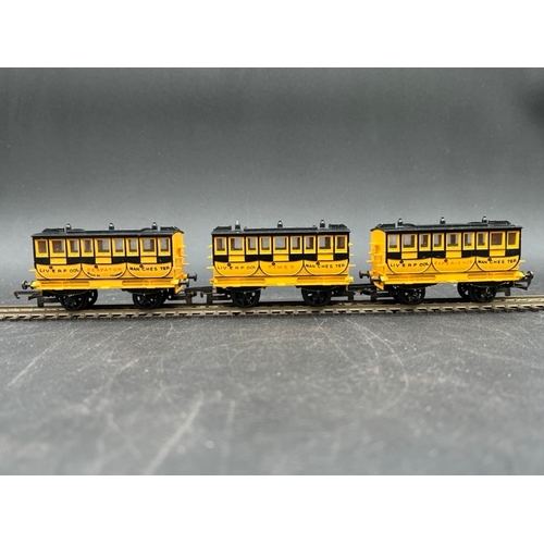 37 - Triang Stephensons Rocket and three coaches
(250g)
Locomotive in pieces (Poor) with wagon (Fair)
and... 