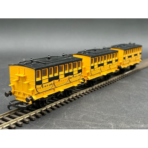 37 - Triang Stephensons Rocket and three coaches
(250g)
Locomotive in pieces (Poor) with wagon (Fair)
and... 