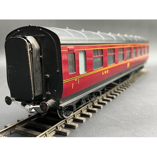 157 - An Edward Exley & Co. O Gauge LMS eight wheel passenger coach, LMS Maroon with black roof, First cla... 