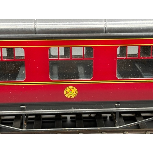 157 - An Edward Exley & Co. O Gauge LMS eight wheel passenger coach, LMS Maroon with black roof, First cla... 