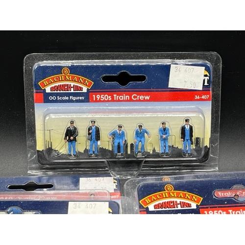 165 - Twenty Bachmann Scenecraft OO scale figure packs and four Shillingstone Wickham trolley huts
(1100g)... 