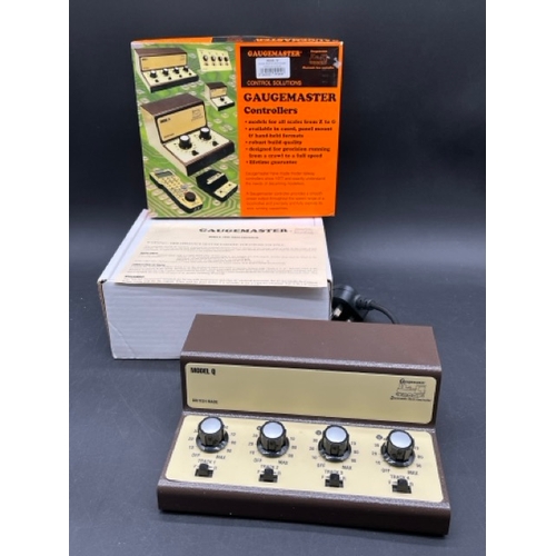 375 - Three OO/HO/N gauge controllers
(5000g)
Gaugemaster Model Q Four track controller - appears unused. ... 
