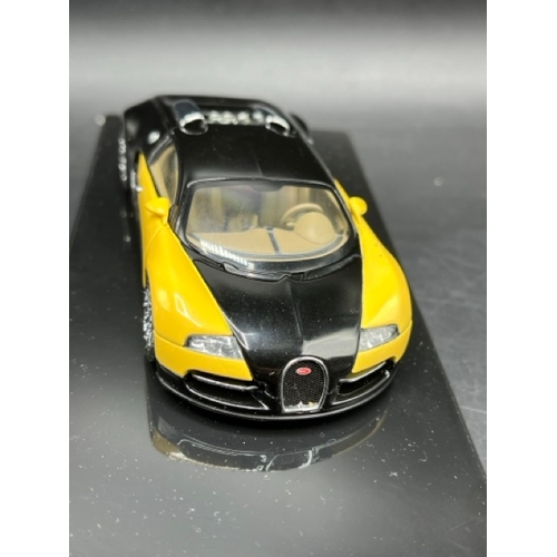19 - 3 AUTOart Bugatti 1:43 models in boxes 
(700g)
50904 Bugatti EB 16.4 Veyron Showcar (Black/Yellow)
5... 