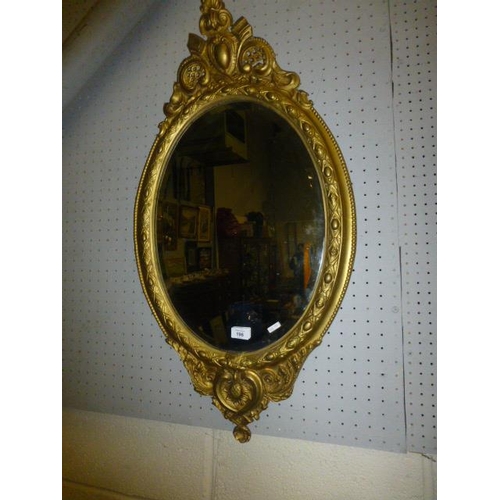 196 - GILT BEVELLED OVAL MIRROR