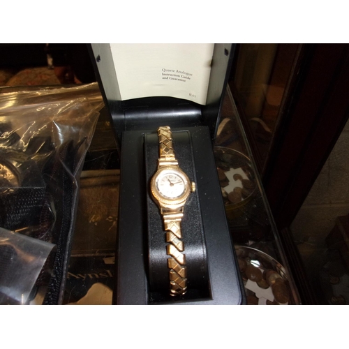 243 - 9CT GOLD CASED LADIES WATCH