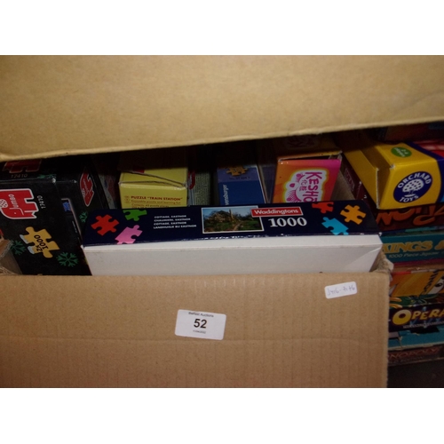 52 - BOX OF JIGSAWS