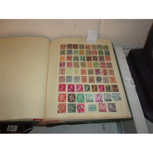 828 - LARGE HEAVY GREEN ALBUM OF WORLD STAMPS MUCH OLD MATERIAL