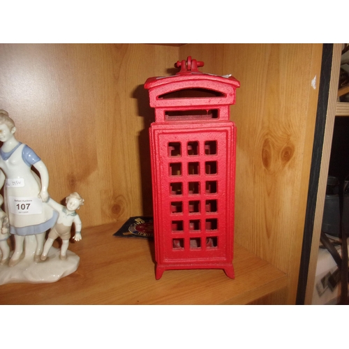 106 - CAST PHONEBOX CANDLESTICK