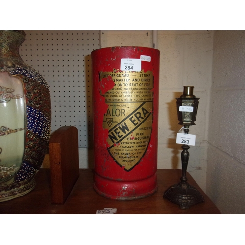 284 - NEW ERA STICK STAND A CUT DOWN FIRE EXTINGUISHER