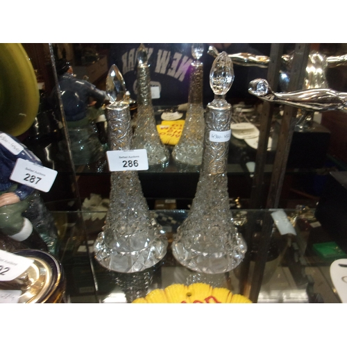 286 - PAIR OF SILVER MOUNTED DECANTERS