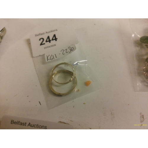 244 - SILVER CLADDAGH RING AND SILVER STONE SET ETERNITY RING