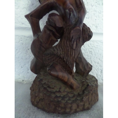 34 - A tall Hand Carved African wooden statue