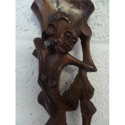 34 - A tall Hand Carved African wooden statue