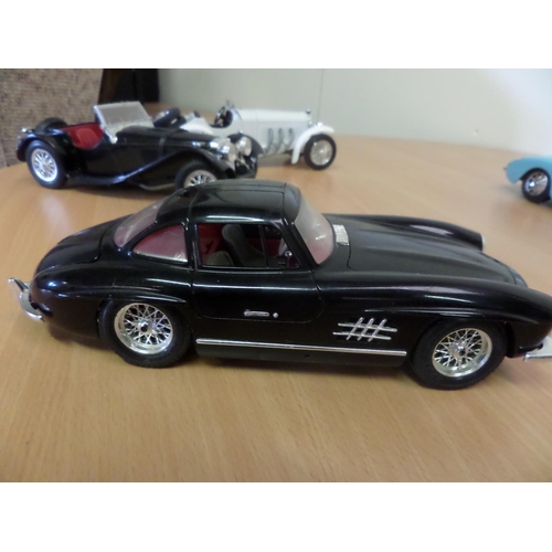 238 - 4 x Burago Models 1:18 Made in Italy 
1. Chevrolet Corvette 1957
2. Mercedes 300 SL
3. Jaguar SS100 ... 