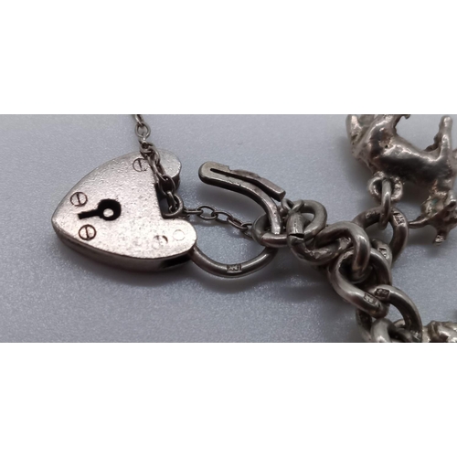 39a - .925 Silver Charm Bracelet 24.42 Grams