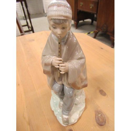 498 - Figurine of Boy Playing a Flute