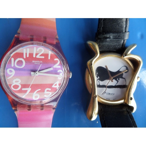 551 - 2 x Watches , One a Modern Picasso Wristwatch on a Leather Strap and a Colourful Swatch Watch