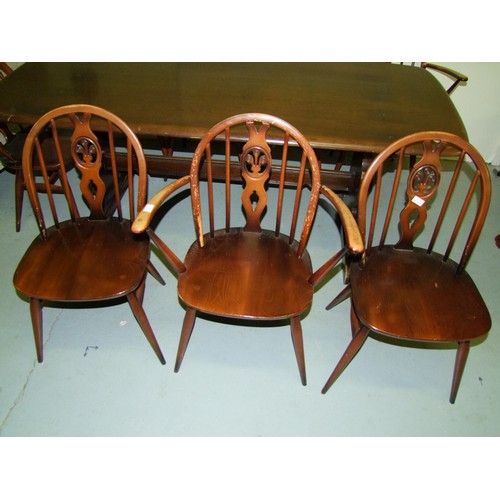 93 - Ercol Dining Table and 8 Chairs (2 Carvers)