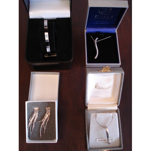 295 - 4 Silver Jewellery Items - 2 Necklaces, 1 Pair of Earrings and a Bracelet