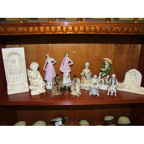 51 - A Shelf of Figurines