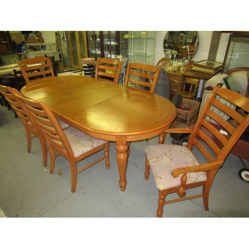 66 - A Pine Dining Table and 6 Chairs with 2 Additional Leaves