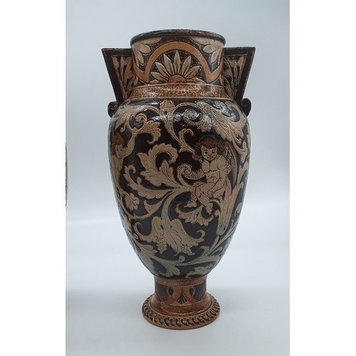 19a - A pair of R.W. Martin Brothers Early Stoneware Vases, 1884, incised and impressed stylised Cherubs a... 