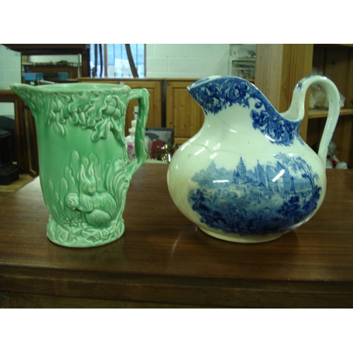 33 - 2 Jugs - 1 Swiss Themed Doulton and 1 x Wade Country Scene