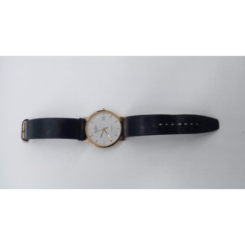 103 - A Vintage Gents Gold Plated Rotary Wristwatch with date and black leather strap in original presenta... 