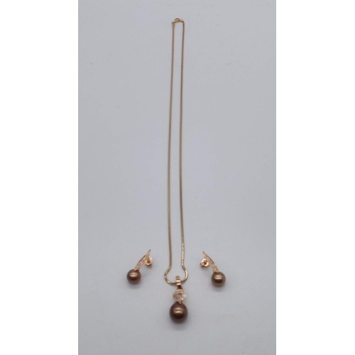 20c - A Tahitian Gold plated Cultured Pearl and Diamond Necklace and matching Earrings set in 18ct Gold (1... 